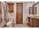 Elegant bathroom with dark wood cabinets and marble vanity at 6876 S Star Dr, Gilbert, AZ 85298