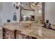 Bathroom features a modern vessel sink and rich wood cabinetry at 6876 S Star Dr, Gilbert, AZ 85298