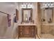 Bathroom with ornate mirror, vanity, and shower at 6876 S Star Dr, Gilbert, AZ 85298