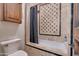 Bathroom with bathtub, shower, and decorative tile at 6876 S Star Dr, Gilbert, AZ 85298