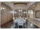 Formal dining room with ornate wallpaper and chandelier at 6876 S Star Dr, Gilbert, AZ 85298