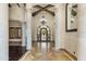 Bright foyer with soaring ceilings, iron work door, and decorative columns in this estate home at 6876 S Star Dr, Gilbert, AZ 85298
