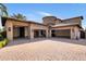 Wide driveway and garage with multiple bays, stone accents, and well-maintained landscaping, ample parking at 6876 S Star Dr, Gilbert, AZ 85298