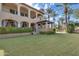 Stunning two-story home with manicured lawn and palm trees at 6876 S Star Dr, Gilbert, AZ 85298