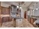 Island kitchen with granite countertops, custom cabinetry, and high-end appliances at 6876 S Star Dr, Gilbert, AZ 85298