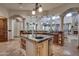 Open kitchen with large island, granite countertops, and breakfast bar at 6876 S Star Dr, Gilbert, AZ 85298