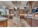 Spacious kitchen featuring granite island, stainless steel appliances, and wood cabinets at 6876 S Star Dr, Gilbert, AZ 85298