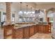 Large kitchen island with granite counters and custom cabinetry at 6876 S Star Dr, Gilbert, AZ 85298