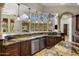 Beautiful kitchen featuring a large island with bar seating and stainless steel appliances at 6876 S Star Dr, Gilbert, AZ 85298