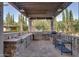 Outdoor kitchen features stone counters, a grill, and a sink at 6876 S Star Dr, Gilbert, AZ 85298