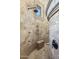 Luxurious walk-in shower, featuring a stone surround, multiple shower heads, and seating at 6876 S Star Dr, Gilbert, AZ 85298