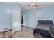 Bedroom with ensuite bathroom and wood flooring at 6924 W Southgate Ave, Phoenix, AZ 85043