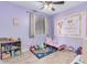 bedroom with playful decor and a toddler bed at 6924 W Southgate Ave, Phoenix, AZ 85043