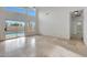 Spacious living area with tiled floors and pool access at 7261 E Black Rock Rd, Scottsdale, AZ 85255