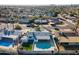 An aerial view showcasing a single-Gathering home with a swimming pool in a residential neighborhood at 7432 E Latham St, Scottsdale, AZ 85257