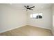 Bright bedroom with ceiling fan and window at 7432 E Latham St, Scottsdale, AZ 85257