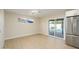 Bright dining area with light flooring and sliding glass doors at 7432 E Latham St, Scottsdale, AZ 85257