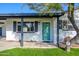 Welcoming front porch with teal door and landscaping at 7432 E Latham St, Scottsdale, AZ 85257