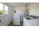 Laundry room with washer and dryer and good natural light at 7432 E Latham St, Scottsdale, AZ 85257