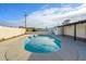 Inviting kidney-shaped pool with surrounding patio at 7432 E Latham St, Scottsdale, AZ 85257