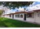 Side view of a single-story home with a grassy lawn at 8020 E Keats Ave # 327, Mesa, AZ 85209