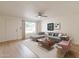 Bright living room with L-shaped sofa and wood-look floors at 8020 E Keats Ave # 327, Mesa, AZ 85209