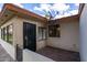 Private patio with brick flooring and wrought iron gate at 8020 E Keats Ave # 327, Mesa, AZ 85209