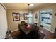 Cozy dining area with dark wood table and kitchen view at 8103 E Southern Ave # 52, Mesa, AZ 85209