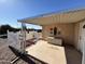 Covered patio with decorative wall art and storage chest at 8103 E Southern Ave # 52, Mesa, AZ 85209