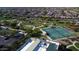 Aerial view of community amenities including park, pickleball courts at 8202 W Merriweather Way, Florence, AZ 85132