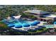 Aerial view of community pool area, including a clubhouse and surrounding landscape at 8202 W Merriweather Way, Florence, AZ 85132