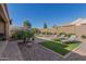 Artificial turf and lounge chairs in this relaxing backyard at 8202 W Merriweather Way, Florence, AZ 85132