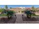 Landscaped backyard with artificial turf and plants at 8202 W Merriweather Way, Florence, AZ 85132