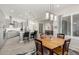 Open concept dining room with a wooden table, adjacent to the kitchen at 8202 W Merriweather Way, Florence, AZ 85132