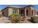 Single-story home with stone accents and landscaped front yard at 8202 W Merriweather Way, Florence, AZ 85132