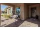 Covered porch with a relaxing swing seat at 8202 W Merriweather Way, Florence, AZ 85132