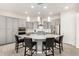 Modern kitchen with gray cabinets, a large island, and stainless steel appliances at 8202 W Merriweather Way, Florence, AZ 85132