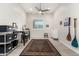 Home office with desk, shelving, and ceiling fan at 8202 W Merriweather Way, Florence, AZ 85132