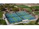 Aerial view of community pickleball courts near golf course at 8202 W Merriweather Way, Florence, AZ 85132