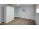 Simple bedroom with wood-look floors and a large wardrobe at 9310 E Main St # 182, Mesa, AZ 85207