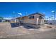 Mobile home with carport and gravel driveway at 9310 E Main St # 182, Mesa, AZ 85207