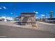 Mobile home exterior with gravel landscaping and a covered patio at 9310 E Main St # 182, Mesa, AZ 85207