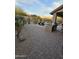 Landscaped backyard with brick pavers and outdoor kitchen at 9600 E Balancing Rock Rd, Scottsdale, AZ 85262