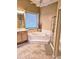 Bathroom with corner soaking tub and shower at 9600 E Balancing Rock Rd, Scottsdale, AZ 85262