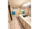 Double sink bathroom with beige tile floor and shower at 9600 E Balancing Rock Rd, Scottsdale, AZ 85262