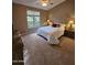 Comfortable bedroom with a queen-size bed and ceiling fan at 9600 E Balancing Rock Rd, Scottsdale, AZ 85262