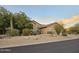 House exterior with drought-tolerant landscaping and a long driveway at 9600 E Balancing Rock Rd, Scottsdale, AZ 85262