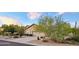 Desert landscaping surrounds this single-story home with a two-car garage at 9600 E Balancing Rock Rd, Scottsdale, AZ 85262