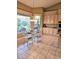 Bright kitchen nook with glass table and chairs, offering garden views at 9600 E Balancing Rock Rd, Scottsdale, AZ 85262