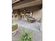 Covered patio with wicker furniture and ceiling fan at 9600 E Balancing Rock Rd, Scottsdale, AZ 85262